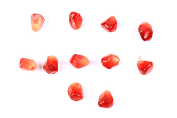 pomegranate grains isolated on white background