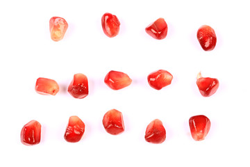 pomegranate grains isolated on white background