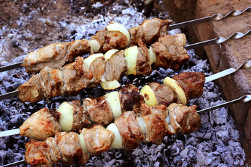 Barbecue over charcoal fire. Meat food background. Grilled food. Beef steak. Bbq restaurant. Summer background. Fire charcoal.