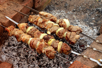 Barbecue over charcoal fire. Meat food background. Grilled food. Beef steak. Bbq restaurant. Summer background. Fire charcoal.