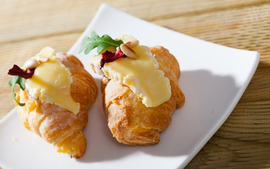 Croissant with Camembert and pine nuts
