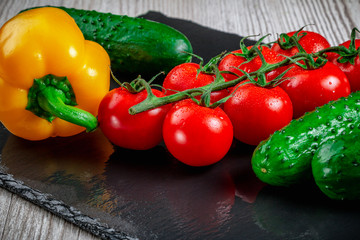 Ripe vegetables on a slate.