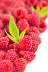 Raspberry with leaves isolated on white background