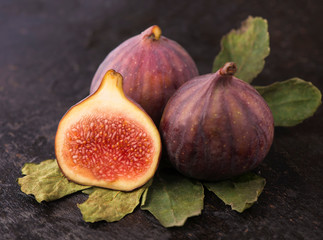 Fresh figs on black background close up