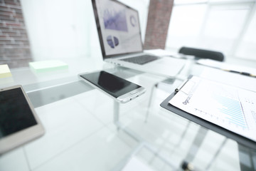 financial chart about the report on the glass table in the office