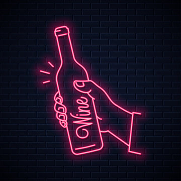 Hand hold wine bottle neon sign. Male hand holding