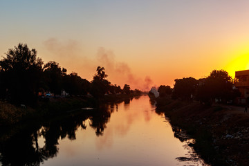 View of irrigation canal at sunset in Egypt