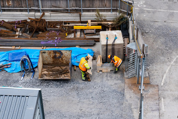 Two construction workers at the sites storage area searching for material, Stockholm Sweden - 261841605