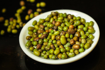mung beans, mash. green beans in a white plate on the table. top food background. copy space