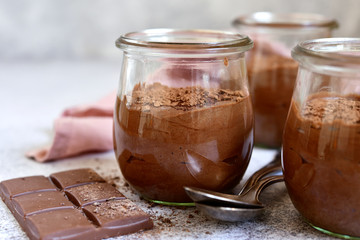 Homemade chocolate mousse in a glass jar.
