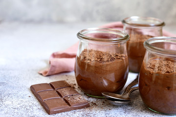 Homemade chocolate mousse in a glass jar.