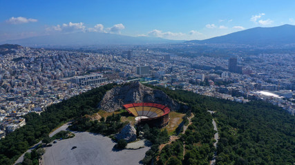 Obraz premium Aerial drone view from of open air theatre on top of Lycabettus hill with views of city of Athens, Greece