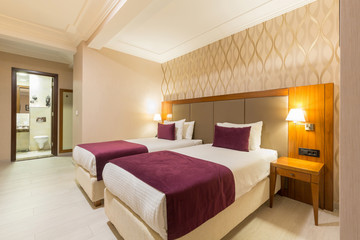 Fototapeta na wymiar Interior of a hotel bedroom in the evening