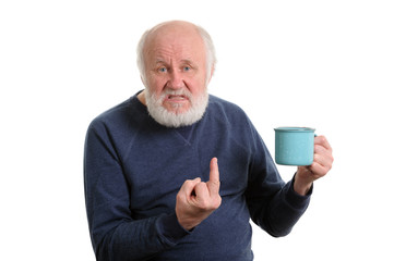 senior man with cup shows middle finger isolated on white