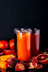 Bottles with different colorful juices. Healthy lifestyle