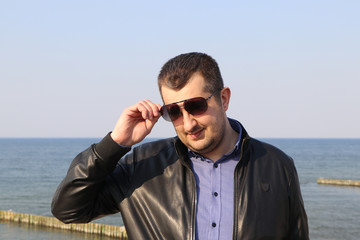 man in sunglasses and a black jacket