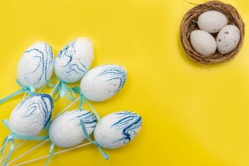 Easter eggs on yellow background