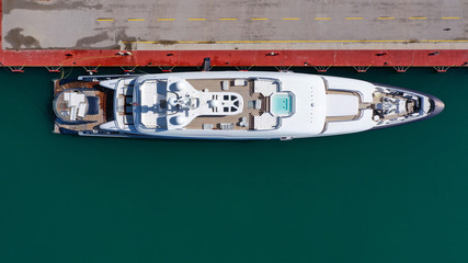 Aerial drone top view photo of luxury yachts docked in mediterranean port