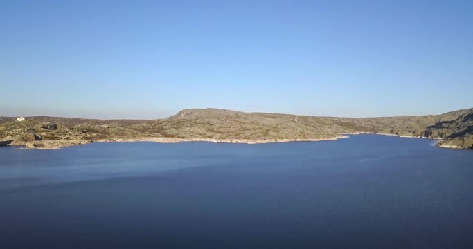 Aerial footage view of dam Marques da Silva and long lagoon , lagoa comprida, in the mountains of Serra da Estrela, Portugal