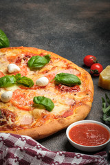 Traditional Italian pizza on a dark background copy space.