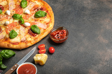 Traditional Italian pizza on a dark background copy space.
