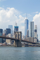 New York City: view of lower Manhattan skyline with One World Trade Center and Brooklyn Bridge