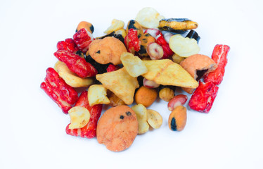 Mix of Japan snacks isolated on white background. Including tempura, nori maki, crackers in nori, close up.