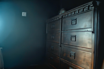 antique chest of drawers / background wooden boxes with handles in vintage wooden furniture wardrobe