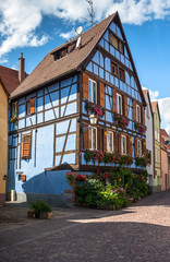 Beautiful half-timbered houses with red tiled roofs in the historic center of Selestat in Alsace.