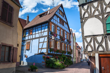 Beautiful half-timbered houses with red tiled roofs in the historic center of Selestat in Alsace.