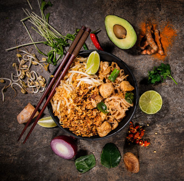 Pad thay asian food background with various ingredients on rustic stone background , top view.