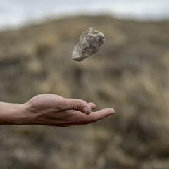 Stone hovering above hand