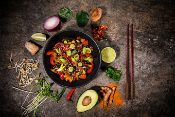 Szechuan beef asian food background with various ingredients on rustic stone background , top view.