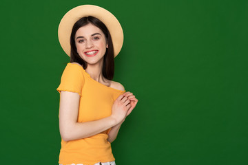 Happy smiling cute girl isolated on green