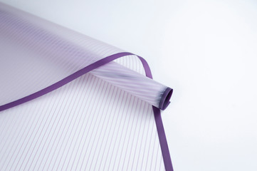 roll of floral packaging in lilac stripes on a white background