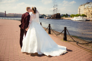 Wedding. Bride and groom walk outdoors