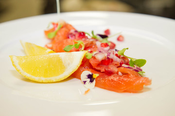 Salmon with pomegranates and onion appetizer