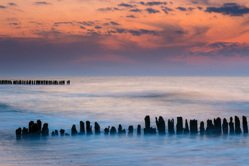 Fototapeta na wymiar Breakwater at beautiful sunset, Baltic Sea, Poland