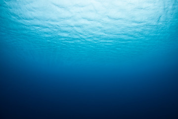 Wind and rain ripple the surface of the Pacific Ocean in the Republic of Palau.