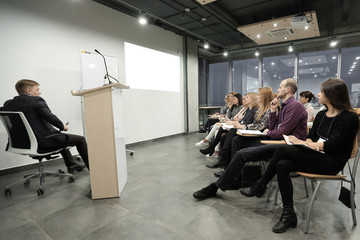 group of business people at a seminar in the modern office