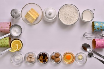 Ingredients yeast dough for Easter cakes, placed around the center, around the edges. On a white...