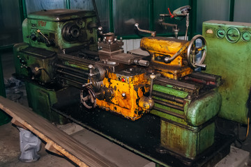 Old lathe in metalworking factory 