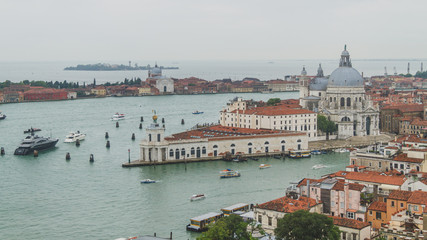 Naklejka na ściany i meble View of city and canal in Venice, with Santa Maria della Salute church