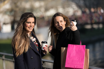 Happy young women with shopping