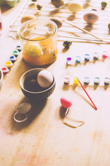 Dyeing eggs for Easter holidays, coloring with different color and tonality using natural food dye...