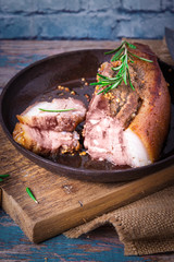 Fried juicy barbecue meat baked in the oven on a baking sheet with french mustard