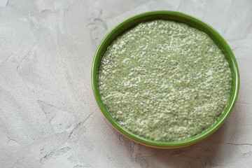 Matcha green tea chia seed pudding bowl. Superfood and vegan concept.
