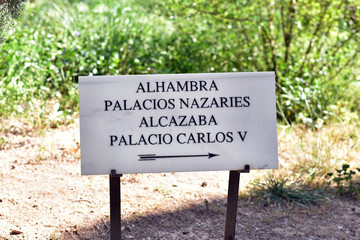 Sign showing the way to Carlos Palace in Alhambra, Granada, Spain