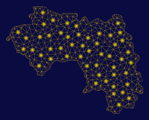 Bright yellow mesh African Guinea map with glow effect. Wire frame triangular mesh in vector EPS10 format on a dark black background. Abstract 2d mesh designed with triangular lines, small circle,