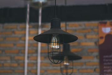 Modern and industrial style lamps in coffee cafe